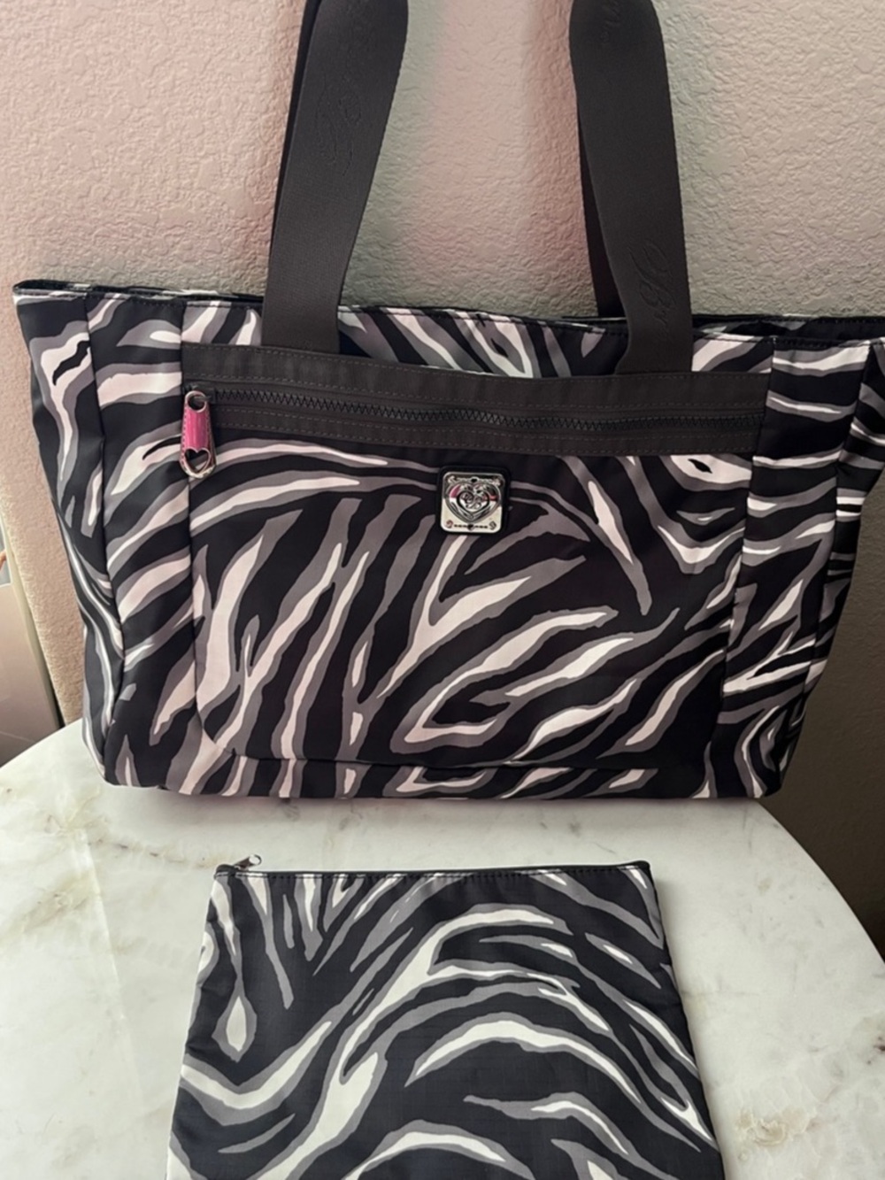 Brighton Black and white patterned Tote bag with multiple zippered pockets.